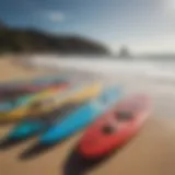 Diverse windboards displayed on a beach