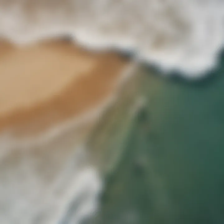 An aerial view of a scenic beach with skimboarders catching waves, illustrating the thrill of the sport.