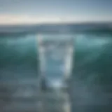 A close-up of a glass of water reflecting sunlight, symbolizing hydration.