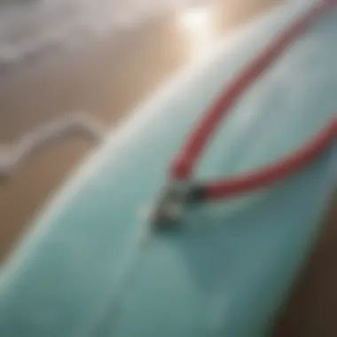 A close-up of a surfboard leash attached to a surfboard