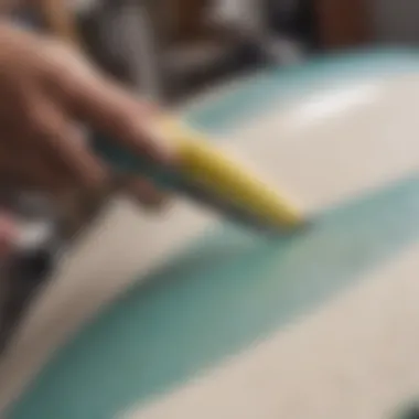 A surfboard being repaired with precision tools