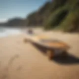 A beautifully crafted longboard resting on a sandy beach.