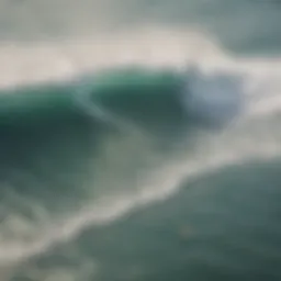 Aerial view of surfers catching waves at a popular beach near Los Angeles