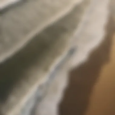 Aerial view of surfers catching waves at Huntington Beach during golden hour