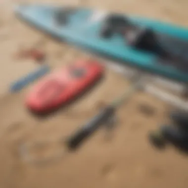 Close-up of kite surfing equipment laid out on the sand