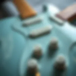A close-up of the Surf Pearl finish on a Stratocaster guitar, showcasing its reflective qualities and depth.