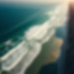 A breathtaking aerial view of Baja coastline with surfers riding waves