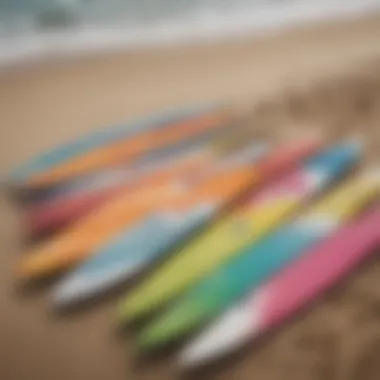 An array of colorful surfboards displayed on a sandy beach, showcasing their designs.