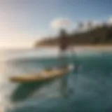 A paddle board with a sail attachment on a calm water surface