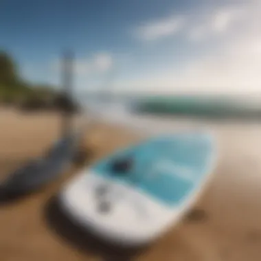 Essential gear for stand up paddle boarding laid out on a sandy beach