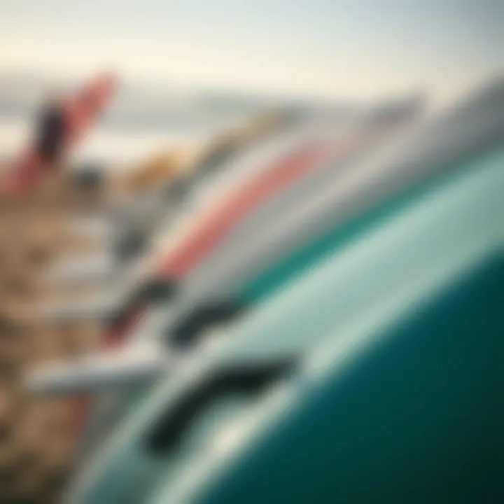 A close-up of surfboards lined up on the beach