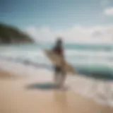 Surf instructor guiding a student on the beach