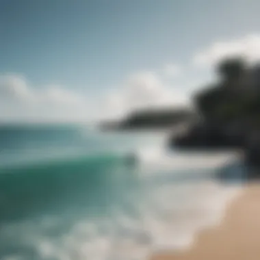 Beautiful Tulum coastline with surfers in the water