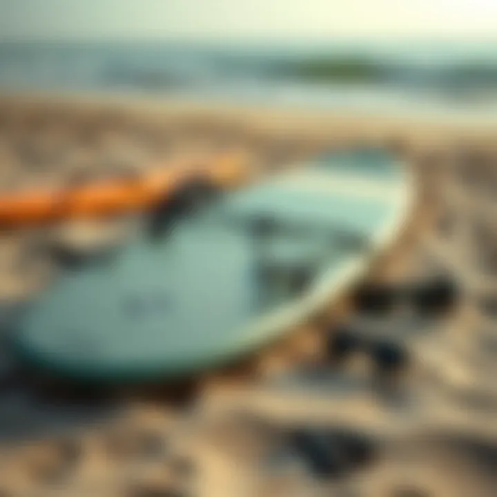 Surfboard gear laid out on sandy beach