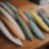 A variety of surfboard fins displayed on a wooden table