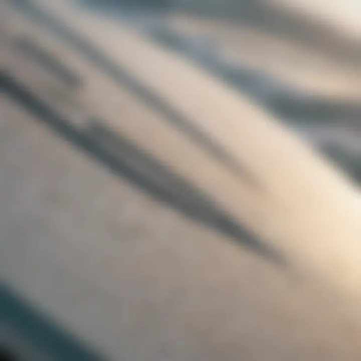 Close-up of a used surfboard with visible wear and tear