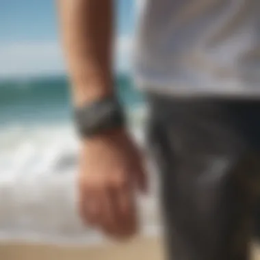 Surfer wearing a shark bracelet magnetic on the beach