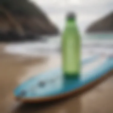 A water bottle beside a surfboard, emphasizing hydration