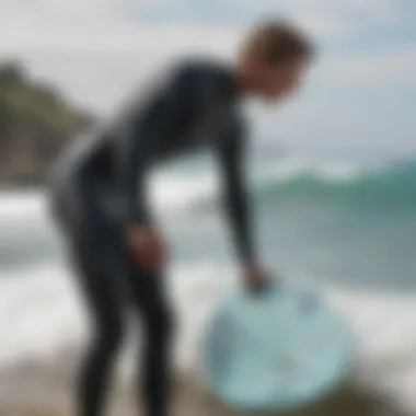 Surfer adjusting wetsuit before hitting the waves