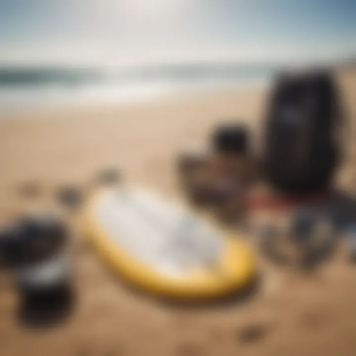 Essential surfing gear laid out on the sand.