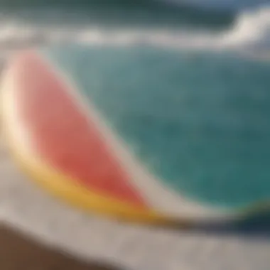 A close-up of a surfboard wax scraper against a vibrant surfboard