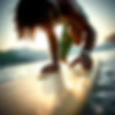 Surfer checking wax grip on surfboard