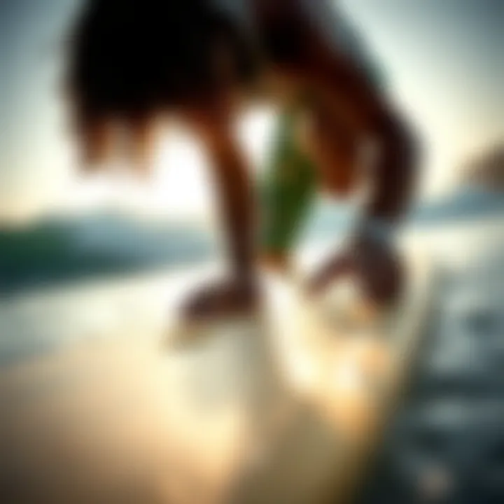 Surfer checking wax grip on surfboard