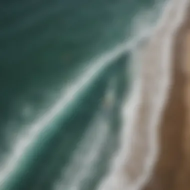 An aerial view of surfers riding the waves