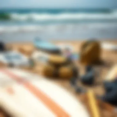 Surfboard and gear laid out on the beach