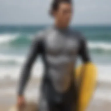 A surfer showcasing a custom-designed wetsuit featuring Japanese motifs