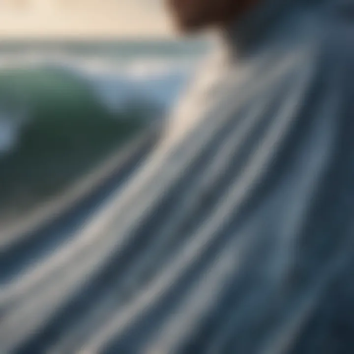 A close-up of the fabric texture of a surf robe poncho showcasing its high-quality material