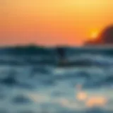 Gliding Over Waves A foil surfer gliding over waves at sunset