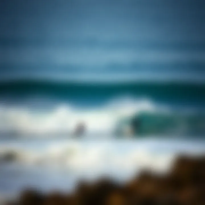 A scenic view of surfers riding waves during high tide