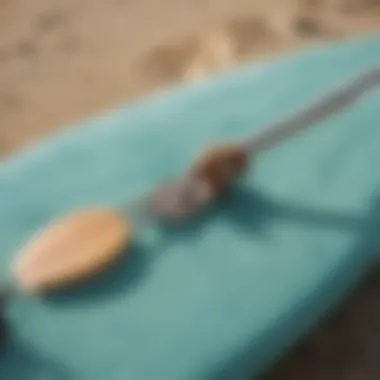 Close-up of a surf key holder attached to a surfboard