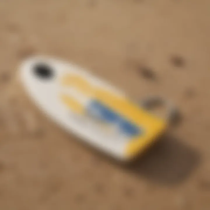 Durable waterproof surf key holder displayed on a sandy beach