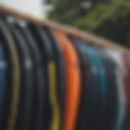 Diverse range of wetsuits displayed on a rack