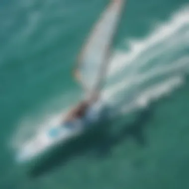 An aerial view of wind surfers gliding over the turquoise waters of Miami.